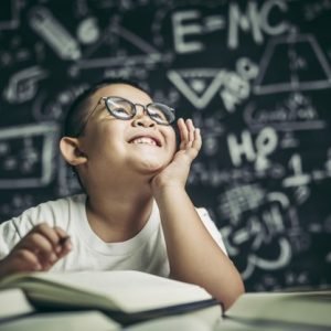 boy-with-glasses-man-writing-classroom_1150-24966