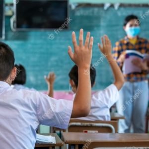 group-asian-elementary-students-wearing-protective-mask-protect-against-covid-19-students-uniform-with-teacher-studying-together-classroom_64073-692